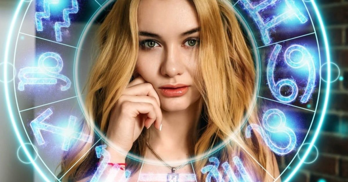 Грешките в любовта, които всяка зодия прави Млада жена с руса коса и зодиакален кръг, символизиращ астрология и хороскоп.