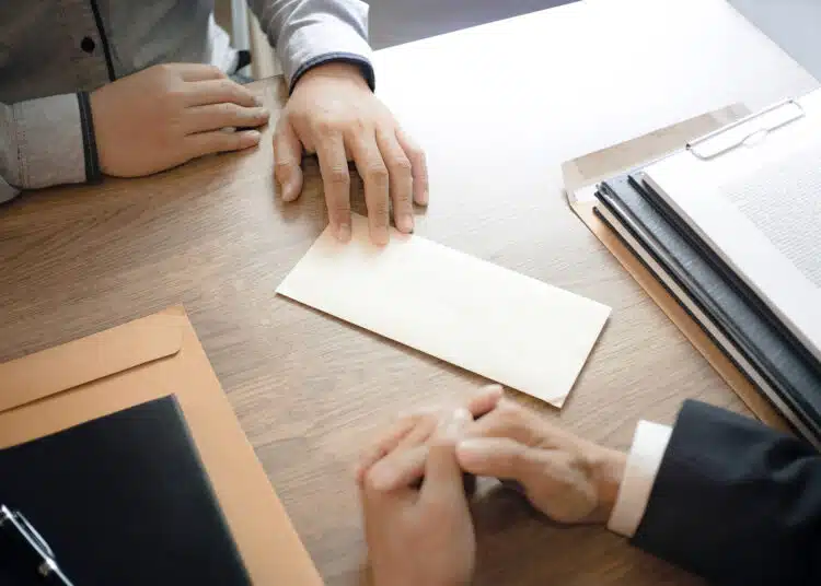 man with resignation letter for quit a job to human resource manager.