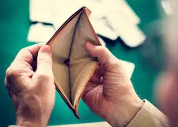 Hands holding empty wallet in a cards circle