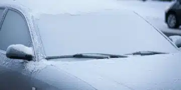 Car windshield covered in frost