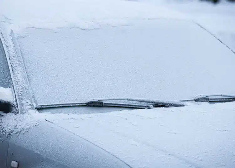 Car windshield covered in frost
