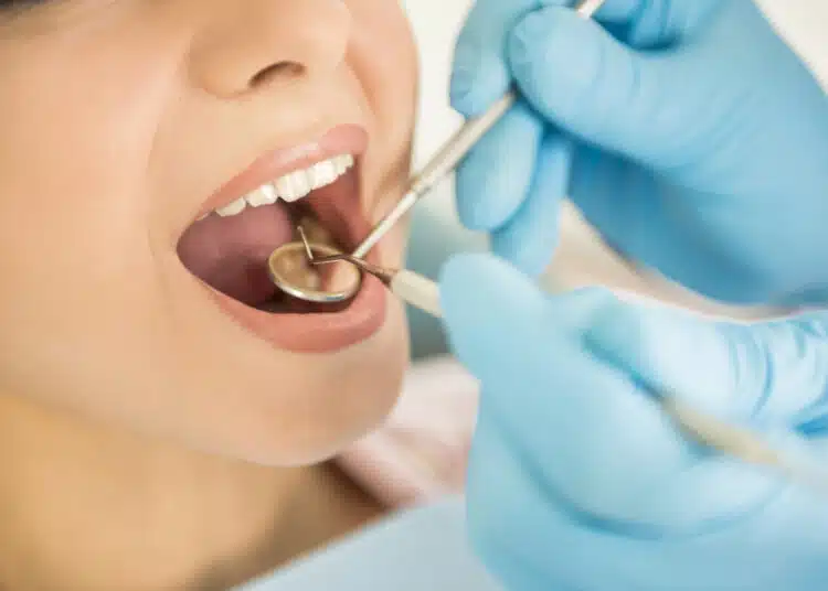 Dentist examining a patient's teeth in the dentist.