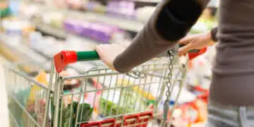Woman grocery shopping in a supermarket