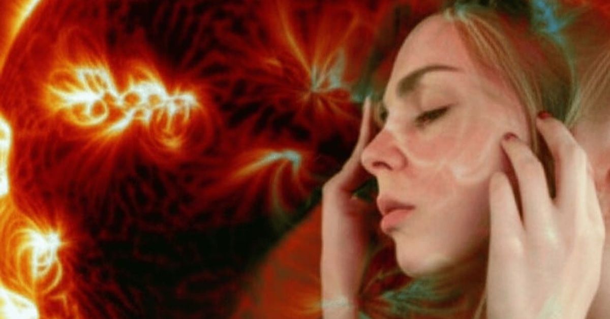 Магнитна буря на 24 септември - какво съобщават експертите Жена със затворени очи и ръце на слепоочията, заобиколена от енергийни потоци.