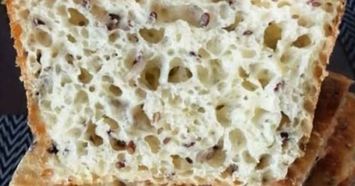Шведски хляб без месене за една нощ: най-лесният начин за хрупкава коричка и меко сърце Апетитна филия домашен хляб с шуплива структура и различни семена